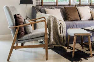 modern wood chair with pillow in living room